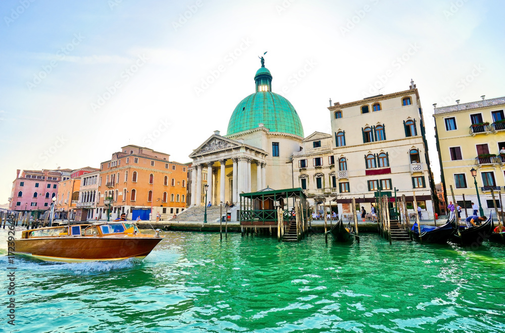 View of the Grand Canal and Venetian houses on a sunny day in Venice