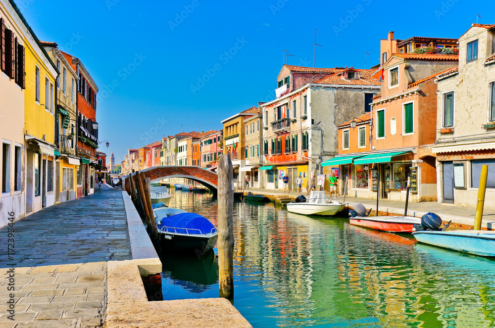View of the colorful Venetian houses along the canal at the Islands of Murano in Venice.