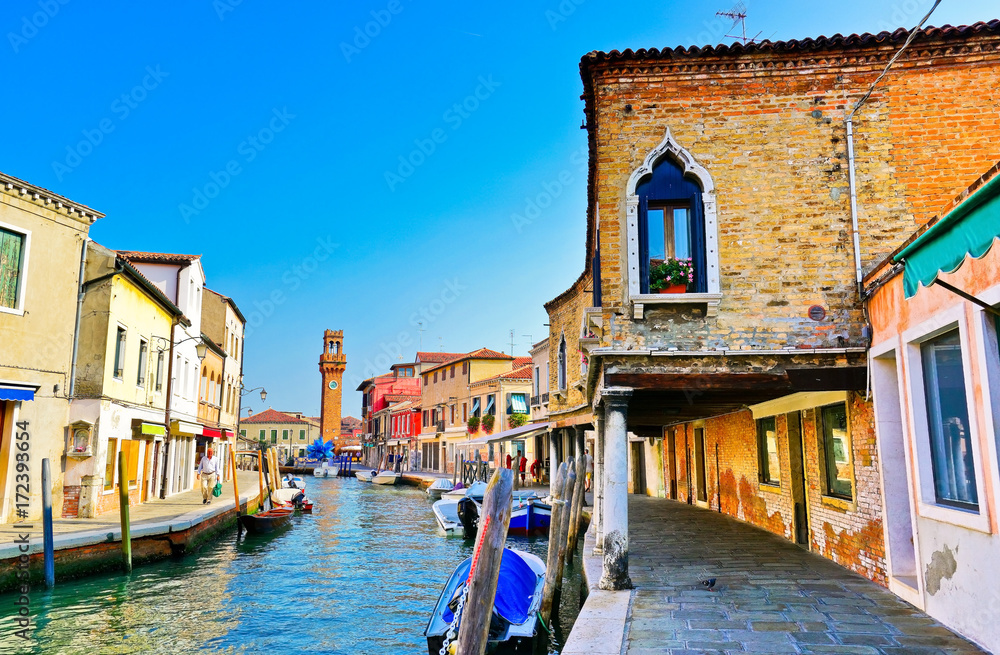 View of the colorful Venetian houses along the canal at the Islands of Murano in Venice.