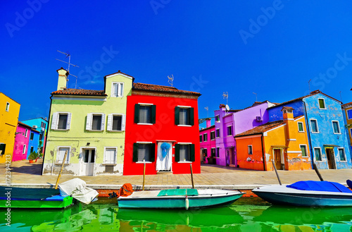 View of the colorful Venetian houses along the canal at the Islands of Burano in Venice.