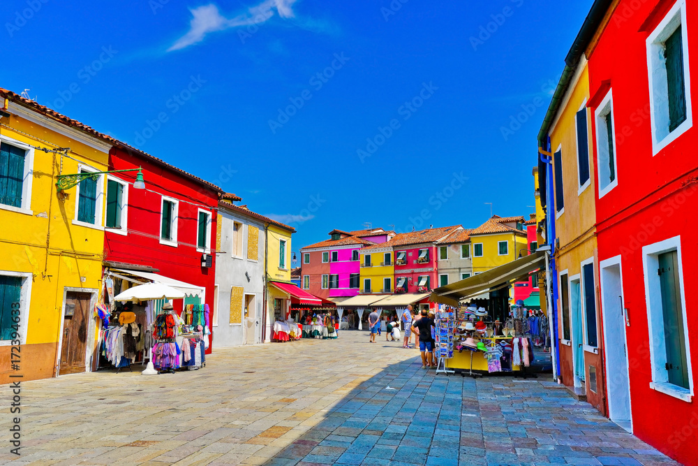 Fototapeta premium View of the colorful Venetian houses along the canal at the Islands of Burano in Venice.
