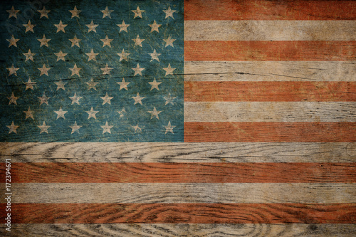 Grunge USA flag on wood bac...