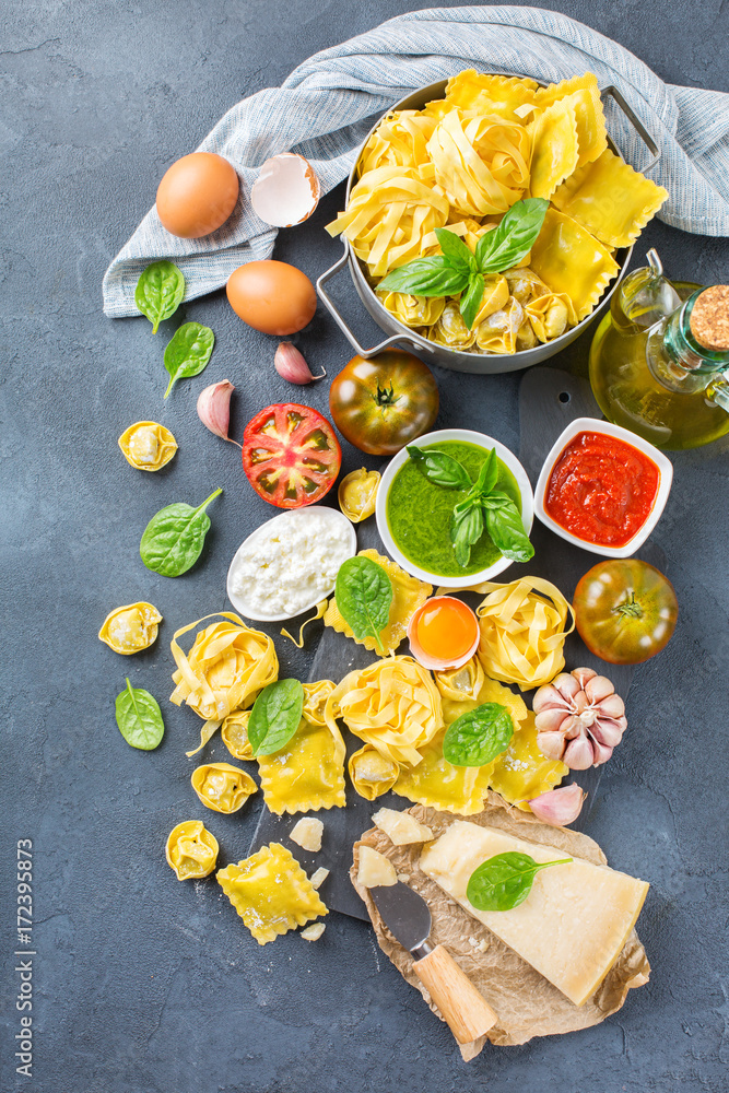 Italian food and ingredients, ravioli pasta tortellini pesto tomato sauce