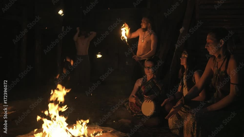 ethno group, they dancing and playing drums and doing fire show ethno group, they dancing and playing drums and doing fire show