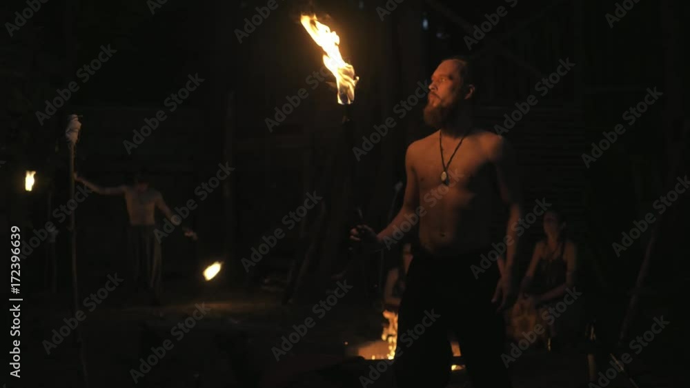 ethno group, they dancing and playing drums and doing fire show ethno group, they dancing and playing drums and doing fire show