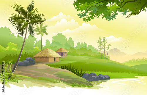 A beautiful village next to a pound, boulders, trees and meadows