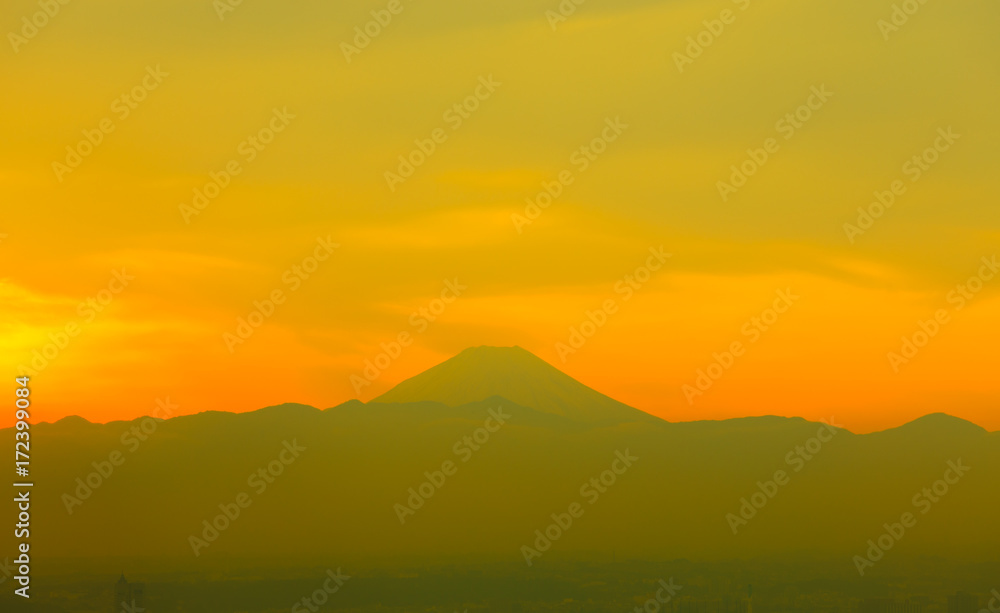 Mountain Fuji with sunset and the town in foregrund