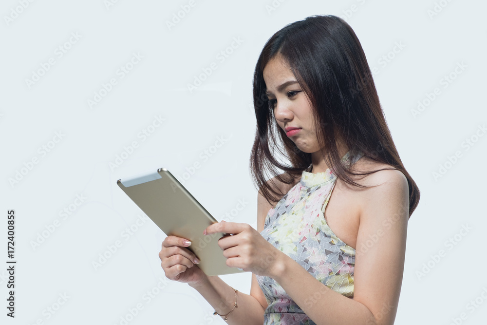 Portrait of beautiful young businesswoman looking tablet on isolated. Asia people businesswoman. Portrait of beautiful young businesswoman looking tablet on isolated. Asia people businesswoman.