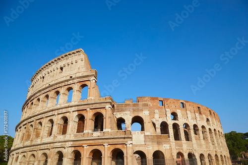 Colosseum against the blue sky in Rome, Italy