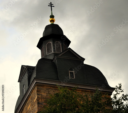 Turm der Schottenkirche vor Wolkenhimmel photo