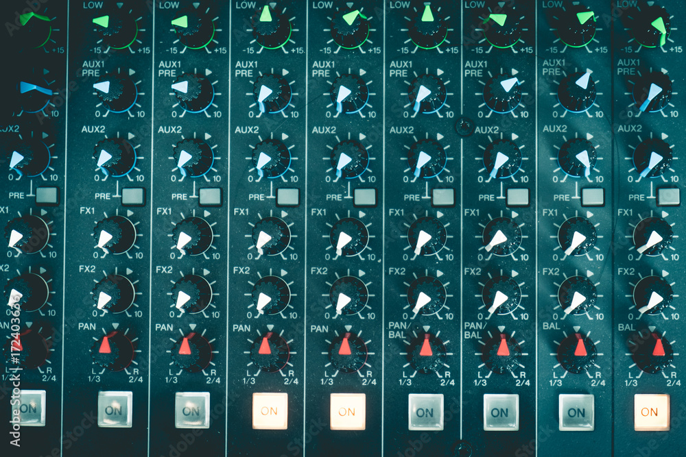 Close up of mixing panel sound working at recording studio. Vintage or retro tone. Close up of mixing panel sound working at recording studio. Vintage or retro tone.