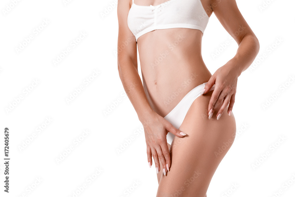 Slim tanned woman's body. Isolated over white background.