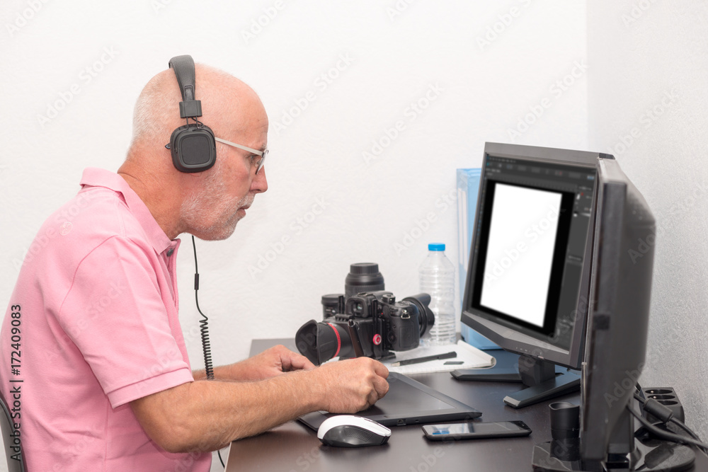 man designer using graphics tablet for editing man designer using graphics tablet for editing