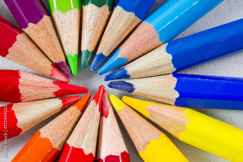 Fototapeta premium Color pencils in round formation on white background extreme close-up