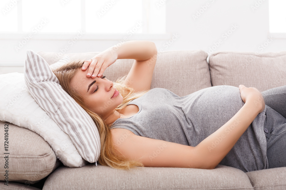 Young expectant blonde with headache Young expectant blonde with headache