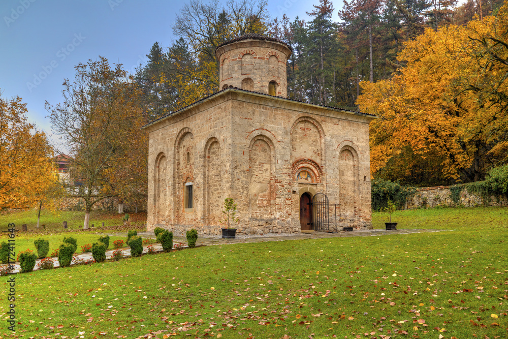 Beautiful stone monastery in autumn forest Beautiful stone monastery in autumn forest
