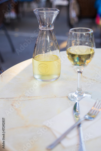 A glass of wine and white wine in a cafe on the table.