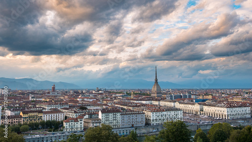 Torino Cityscape, Italia. Skyline panoramic view of Turin, Italy, at dusk with glowing city lights. The Mole Antonelliana illuminated, scenic effect.