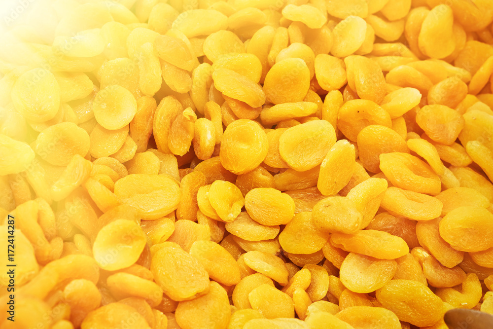 Dried apricots in the store. Background. Toned. Dried apricots in the store. Background. Toned.