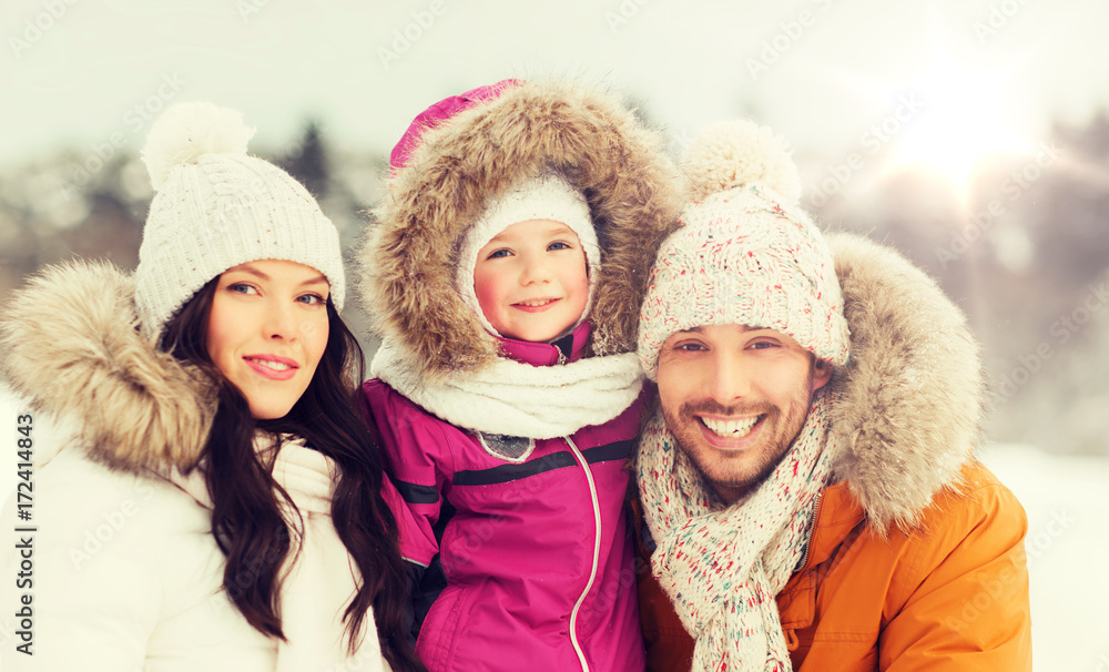 happy family with child in winter clothes outdoors happy family with child in winter clothes outdoors