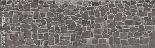 Fototapeta Tekstura kamiennej ściany. Stary grodowy kamiennej ściany tekstury tło. Kamienna ściana jako tekstura lub tło. Przykład muru jako okładziny ścian zewnętrznych.