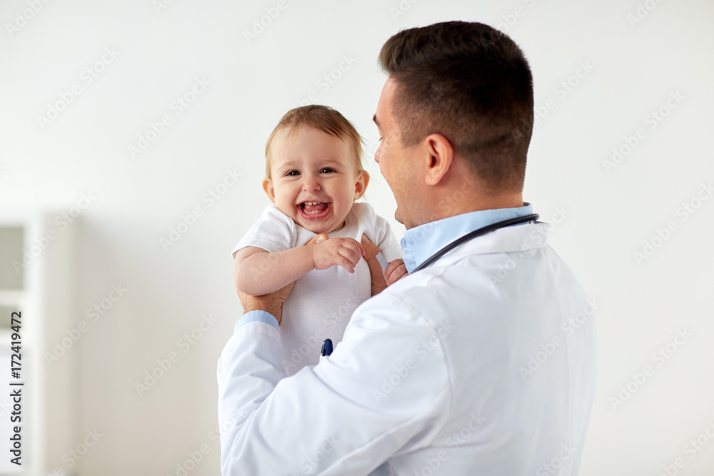 happy doctor or pediatrician with baby at clinic happy doctor or pediatrician with baby at clinic