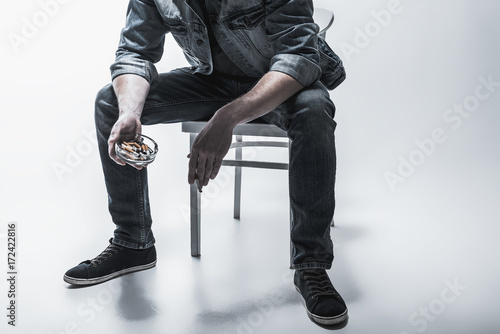 Young man smoking with relaxation
