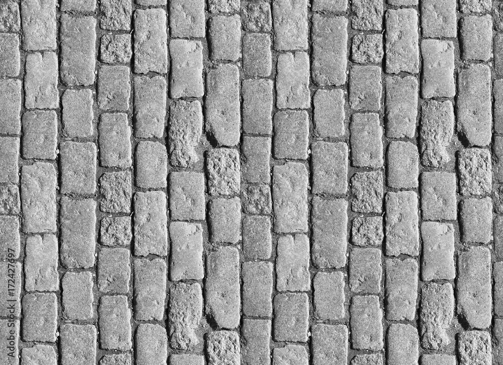 Stone pavement texture. Granite cobblestoned pavement background. Abstract background of old cobblestone pavement close-up. Seamless texture. Perfect tiled on all sides - obrazy, fototapety, plakaty 