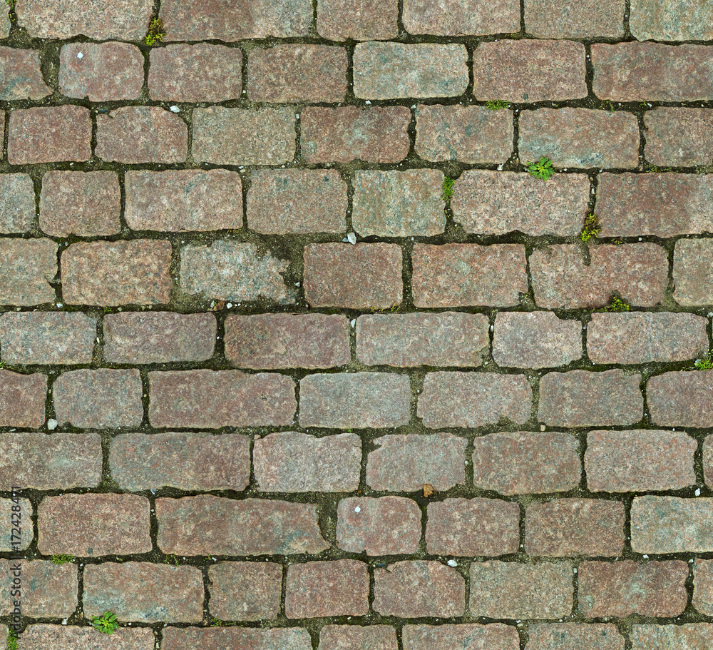 Stone pavement texture. Granite cobblestoned pavement background. Abstract background of old cobblestone pavement close-up. Seamless texture. Perfect tiled on all sides Stone pavement texture. Granite cobblestoned pavement background. Abstract background of old cobblestone pavement close-up. Seamless texture. Perfect tiled on all sides