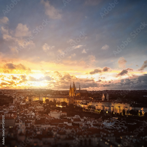 Beautiful aerial sunset view of the Prague city, panoramic view with a castle on the horizon from above. Amazing city landscape