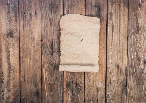 Old parchment on wooden background
