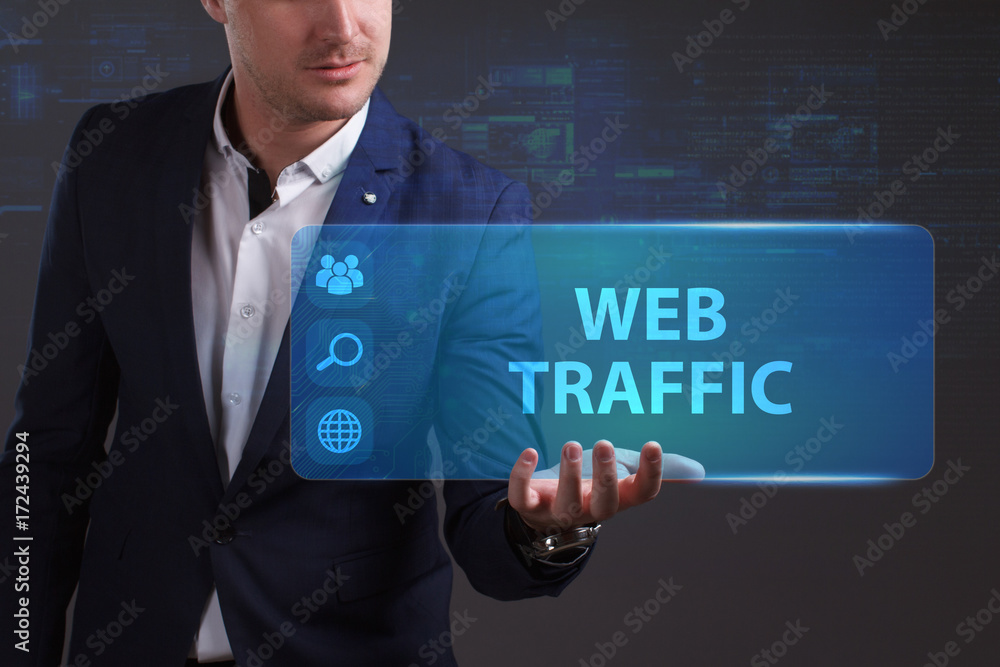 Business, Technology, Internet and network concept. Young businessman working on a virtual screen of the future and sees the inscription: Web traffic Business, Technology, Internet and network concept. Young businessman working on a virtual screen of the future and sees the inscription: Web traffic