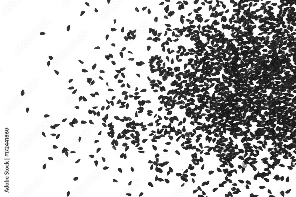Pile of black cumin seeds isolated on white background, top view Pile of black cumin seeds isolated on white background, top view