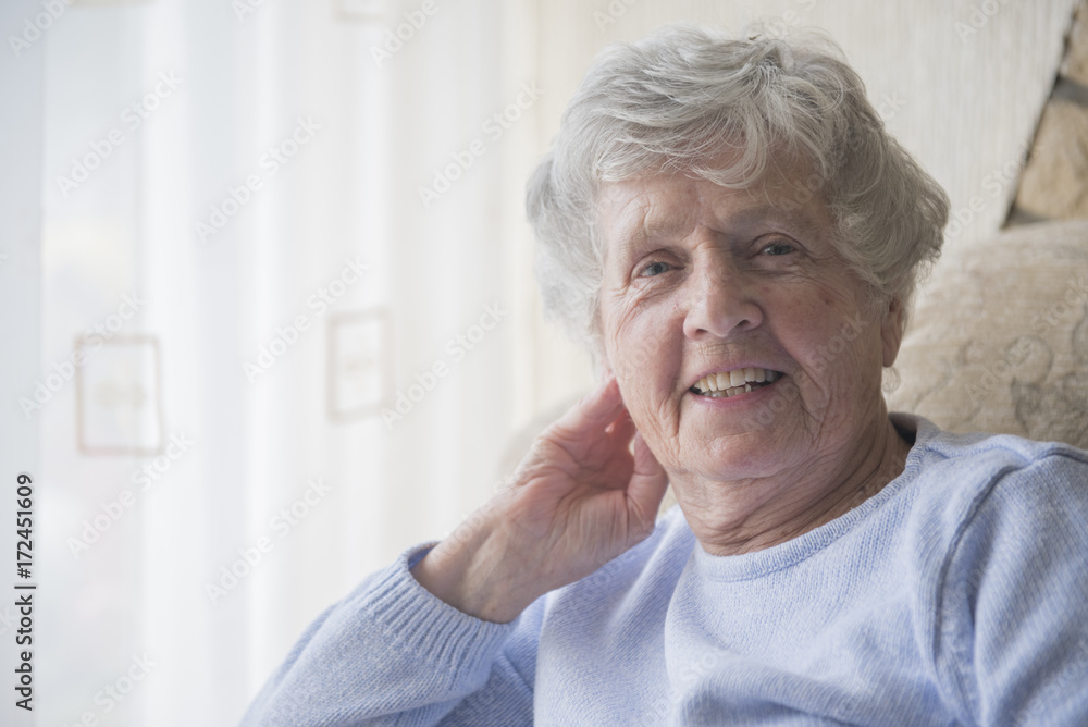 Happy senior woman indoors smiling Happy senior woman indoors smiling