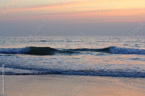 View from a beach on a sunset over the ocean. Coast of India  Indian Ocean