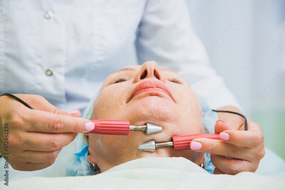 muscle toning procedure for senior woman in cosmetology clinic muscle toning procedure for senior woman in cosmetology clinic