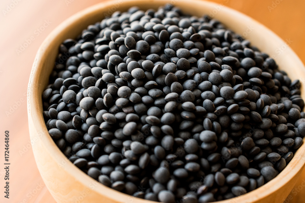 Black Beluga Lentils in wooden spoon. Black Beluga Lentils in wooden spoon.
