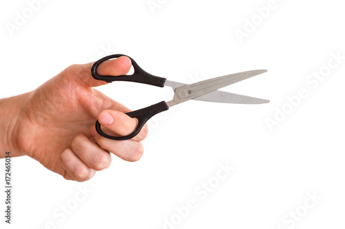Man's hand using a scissors isolated on the white background.