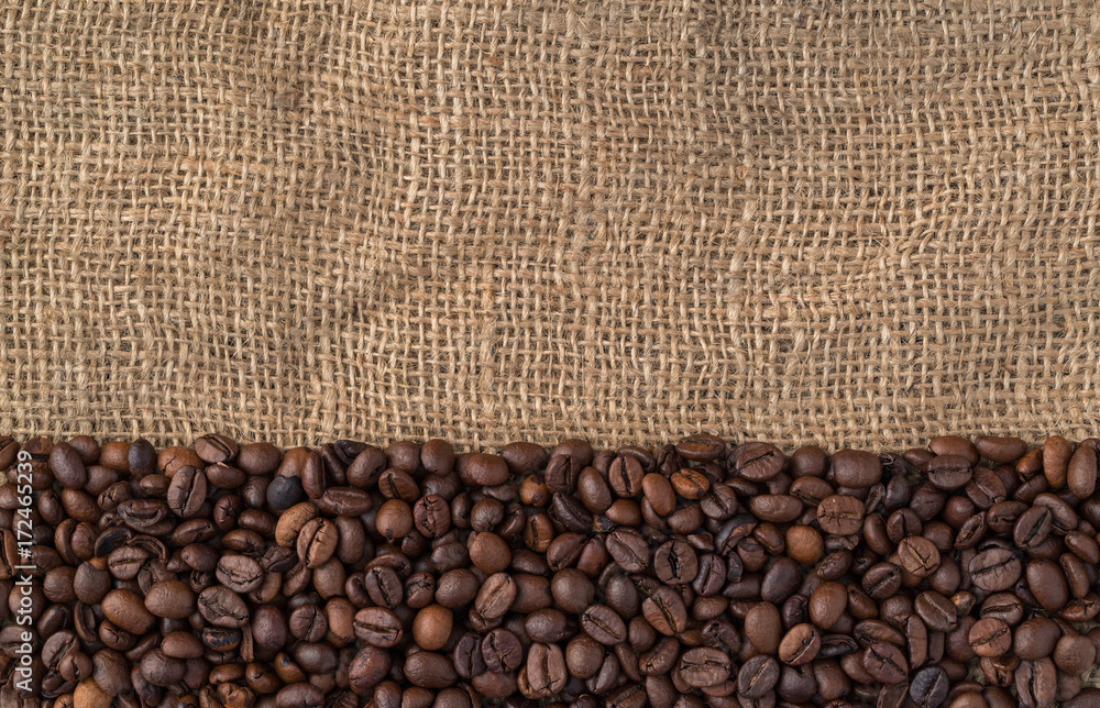 Mixture of different kinds of coffee beans on jute background. Mixture of different kinds of coffee beans on jute background.