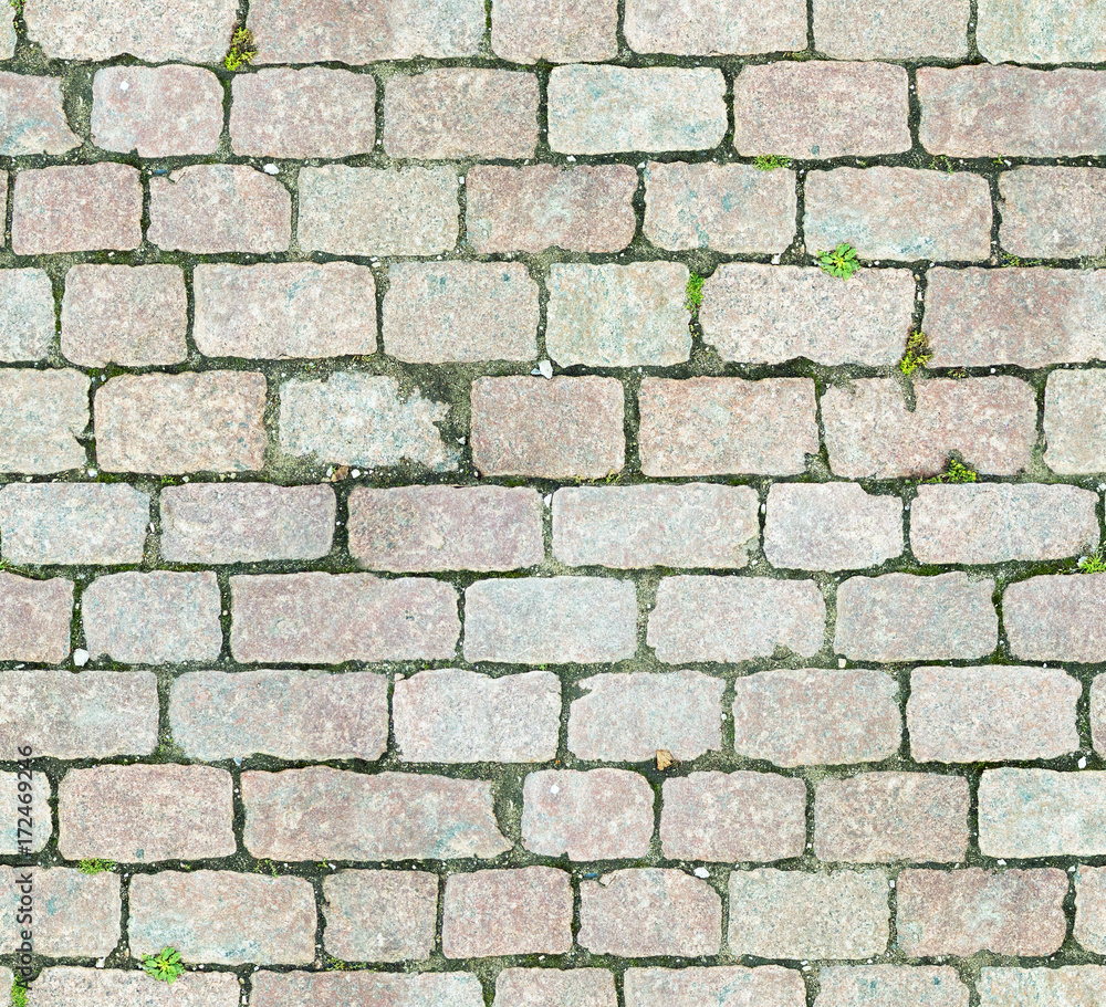 Stone pavement texture. Granite cobblestoned pavement background. Abstract background of old cobblestone pavement close-up. Seamless texture. Perfect tiled on all sides Stone pavement texture. Granite cobblestoned pavement background. Abstract background of old cobblestone pavement close-up. Seamless texture. Perfect tiled on all sides