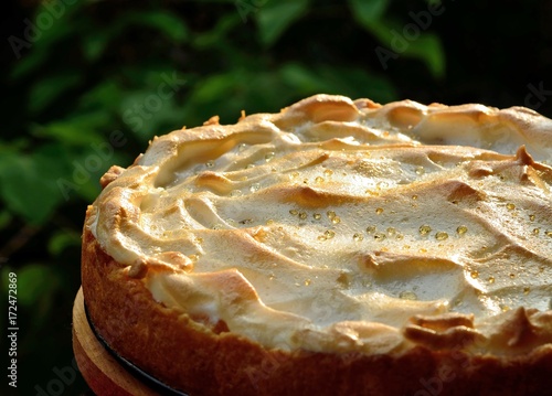 Shortbread cake with meringue and syrup droplets on surface
