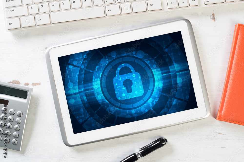 Web security and technology concept with tablet pc on wooden table Web security and technology concept with tablet pc on wooden table