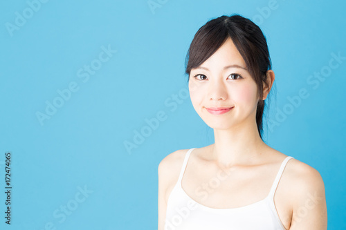 attractive asian woman beauty image isolated on blue background