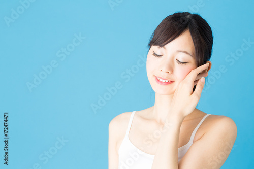 attractive asian woman beauty image isolated on blue background