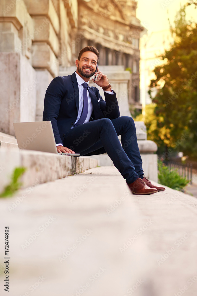 Young businessman on the stairs Young businessman on the stairs