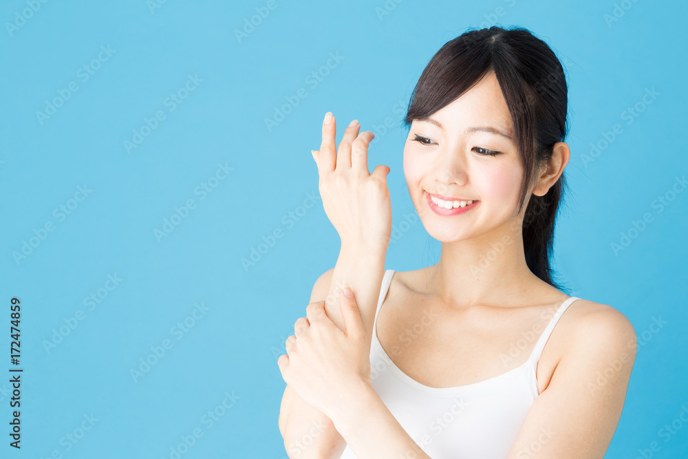 attractive asian woman beauty image isolated on blue background attractive asian woman beauty image isolated on blue background