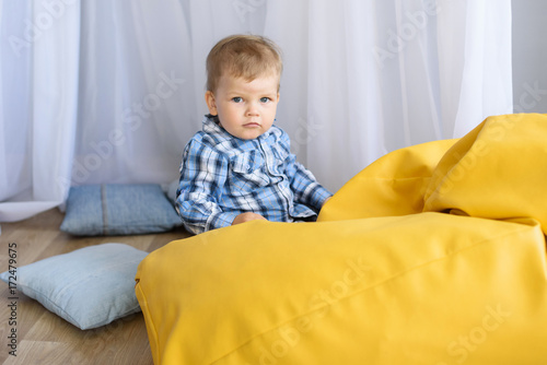 Portrait of a happy young little child boy at home