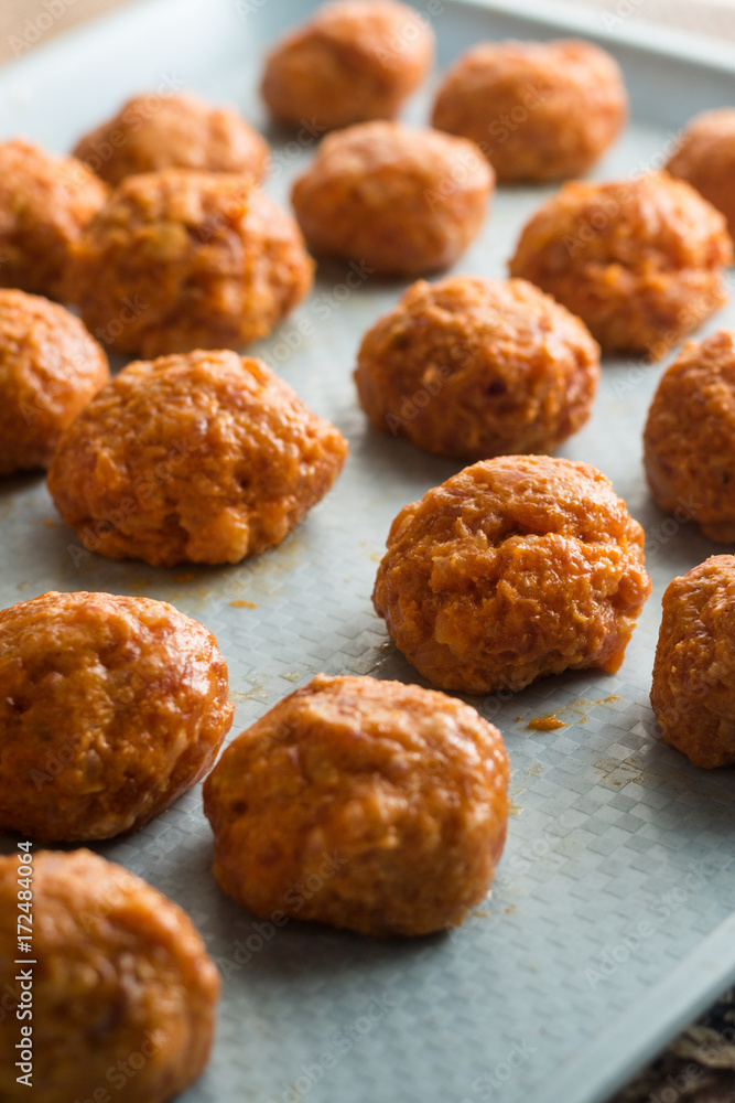 Meatballs prepared for baking in the oven