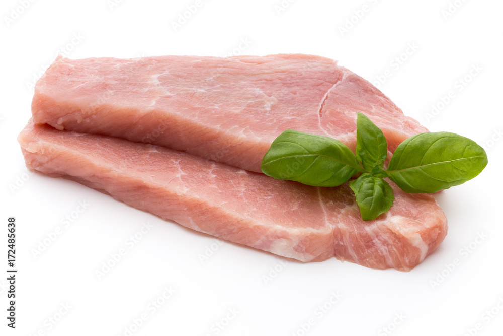 Fresh pork fillet with basil on a white background. Fresh pork fillet with basil on a white background.
