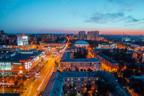 Voronezh, Russia - September 17, 2017: Aerial night view of Voronezh downtown. Kirov street, modern buildings, shops, business center, circus